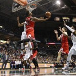 Chicago Bulls' Jimmy Butler (21) drives against the Milwaukee Bucks who tail on the play during the first half of Game 6 of an NBA basketball first-round playoff series Thursday, April 30, 2015, in Milwaukee. (AP Photo/Jeffrey Phelps)