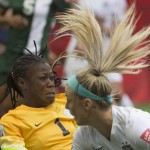 United States' Julie Johnston tries to get a shot past Nigeria goalkeeper Precious Dede during the first half of a FIFA Women's World Cup soccer match, Tuesday, June 16, 2015 in Vancouver, New Brunswick, Canada (Jonathan Hayward/The Canadian Press via AP)