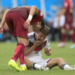Portugal's Pepe , left, puts his head on Germany's Thomas Mueller during the group G World Cup soccer match between Germany and Portugal at the Arena Fonte Nova in Salvador, Brazil, Monday, June 16, 2014. Pepe was red carded after this. (AP Photo/Bernat Armangue)