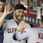  Cleveland Indians' Jason Kipnis, right, gets a high-five from teammate George Kottaras, left, after Kipnis scored against the Arizona Diamondbacks during the seventh inning of a baseball game Wednesday, June 25, 2014, in Phoenix. The Indians defeated the Diamondbacks 6-1. (AP Photo/Ross D. Franklin)