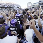 TCU players and fans celebrate a 37-33 win over Oklahoma after a NCAA college football game at Amon G. Carter Stadium, Saturday, Oct. 4, 2014, in Fort Worth, Texas. (AP Photo/Brandon Wade)
