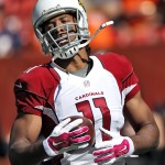 Arizona Cardinals wide receiver Larry Fitzgerald (11) warms up prior to an NFL football game against the Denver Broncos, Sunday, Oct. 5, 2014, in Denver. (AP Photo/David Zalubowski)