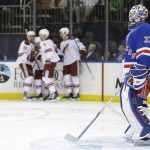 New York Rangers goalie Cam Talbot (33) reacts as the Arizona Coyotes celebrate a goal by Mark Arcobello during the first period of an NHL hockey game Thursday, Feb. 26, 2015, in New York. (AP Photo/Frank Franklin II)