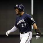Milwaukee Brewers' Carlos Gomez reacts after bunting safely during the first inning of a baseball game against the Arizona Diamondbacks Wednesday, May 7, 2014, in Milwaukee. (AP Photo/Morry Gash)