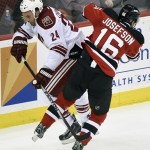 Arizona Coyotes' Kyle Chipchura (24) collides with New Jersey Devils' Jacob Josefson (16) during the second period of an NHL hockey game Monday, Feb. 23, 2015, in Newark, N.J. (AP Photo/Bill Kostroun)