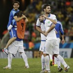 Greece's Andreas Samaris celebrates with Greece's Giannis Maniatis (2) after their 2-1 victory over Ivory Coast during the group C World Cup soccer match between Greece and Ivory Coast at the Arena Castelao in Fortaleza, Brazil, Tuesday, June 24, 2014. (AP Photo/Bernat Armangue)