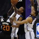 New Orleans Pelicans' Khem Birch, right, and New Orleans Pelicans' Bryce Dejean-Jones try to block Phoenix Suns' Archie Goodwin during the first half of an NBA summer league basketball game Sunday, July 19, 2015, in Las Vegas. (AP Photo/John Locher)
