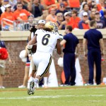 UCLA linebacker Eric Kendricks (6) returns an interception for a touchdown during the first half of an NCAA college football game against Virginia at Scott Stadium, Saturday, Aug. 30, 2014, in Charlottesville, Va. (AP Photo/Andrew Shurtleff)