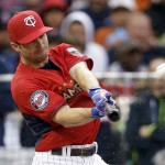  American League's Brian Dozier, of the Minnesota Twins, hits during the MLB All-Star baseball Home Run Derby, Monday, July 14, 2014, in Minneapolis. (AP Photo/Jeff Roberson)