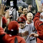  Arizona Diamondbacks' Tony Campana celebrates in the dugout after scoring on a wild pitch against the Los Angeles Dodgers during the ninth inning of a baseball game in Los Angeles, Friday, April 18, 2014. (AP Photo/Chris Carlson)