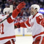 Detroit Red Wings center Pavel Datsyuk (13), of Russia, celebrates his goal against the Tampa Bay Lightning with left wing Tomas Tatar (21), of Slovakia, during the third period of Game 5 of a first-round NHL Stanley Cup hockey playoff series Saturday, April 25, 2015, in Tampa, Fla. The Red Wings won 4-0 and lead the series 3-2. (AP Photo/Chris O'Meara)