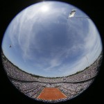 In this image made with a fish-eye lens center court is seen in the men's final of the French Open tennis tournament between Serbia's Novak Djokovic and Switzerland's Stan Wawrinka at the Roland Garros stadium, in Paris, France, Sunday, June 7, 2015. (AP Photo/David Vincent)

