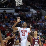 Arizona forward Rondae Hollis-Jefferson, center, watches his shot roll into the basket as Texas Southern forward Tonnie Collier, left, and David Blanks watch during the second half of an NCAA college basketball second-round game in Portland, Ore., Thursday, March 19, 2015. Arizona won 93-72. (AP Photo/Greg Wahl-Stephens)