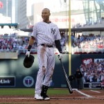 Shortstop Derek Jeter, of the New York Yankees, waves to the crowd during the first inning of the MLB All-Star baseball game, Tuesday, July 15, 2014, in Minneapolis. (AP Photo/Jim Mone)