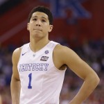 Kentucky's Devin Booker reacts after the NCAA Final Four tournament college basketball semifinal game against Wisconsin Saturday, April 4, 2015, in Indianapolis. Wisconsin won 71-64. (AP Photo/Michael Conroy)