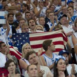 A United States fan waves a national flag to cheer his team at the end of the match against Finland at the Basketball World Cup in Bilbao northern Spain, Saturday, Aug. 30, 2014. (AP Photo/Alvaro Barrientos)