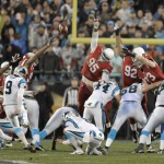Carolina Panthers' Graham Gano (9) kicks a field goal against the Arizona Cardinals in the first half of an NFL wild card playoff football game in Charlotte, N.C., Saturday, Jan. 3, 2015. (AP Photo/Mike McCarn)