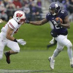 Northwestern wide receiver Kyle Prater (21), right, runs with the ball against Wisconsin linebacker Jesse Hayes (41) during the first half of an NCAA college football game in Evanston, Ill., Saturday, Oct. 4, 2014. (AP Photo/Nam Y. Huh)