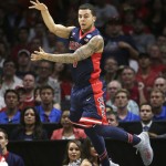 Arizona guard Gabe York tries to keep the ball in-bounds against Wisconsin in the first half of a college basketball regional final in the NCAA Tournament, Saturday, March 28, 2015, in Los Angeles. (AP Photo/Jae C. Hong)