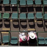 Fans sit in their seats before the 141th running of the Kentucky Oaks horse race at Churchill Downs Friday, May 1, 2015, in Louisville, Ky. (AP Photo/Charlie Riedel)