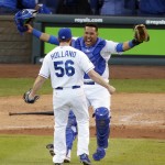 Kansas City Royals relief pitcher Greg Holland and catcher Salvador Perez celebrate after the Royals defeated the Baltimore Orioles 2-1 in Game 4 of the American League baseball championship series Wednesday, Oct. 15, 2014, in Kansas City, Mo. The Royals advance to the World Series. (AP Photo/Michael Conroy)