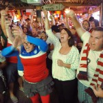 Soccer fans cheer after the USA scores a goal early in their World Cup match against Ghana Monday, June 16, 2014 at Lynch's Irish Pub in Jacksonville Beach, Fla. (AP Photo/The Florida Times-Union, Will Dickey)