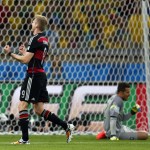 Germany's Andre Schuerrle celebrates after scoring his side's sixth goal during the World Cup semifinal soccer match between Brazil and Germany at the Mineirao Stadium in Belo Horizonte, Brazil, Tuesday, July 8, 2014. (AP Photo/Frank Augstein)