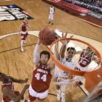 Wisconsin's Frank Kaminsky (44) goes up for a basket against Duke's Jahlil Okafor during the first half of the NCAA Final Four college basketball tournament championship game Monday, April 6, 2015, in Indianapolis. (AP Photo/Chris Steppig, Pool)