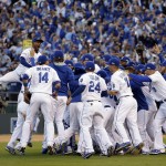 The Kansas City Royals players celebrate after the Royals defeated the Baltimore Orioles 2-1 in Game 4 of the American League baseball championship series Wednesday, Oct. 15, 2014, in Kansas City, Mo. The Royals advance to the World Series. (AP Photo/Matt Slocum)