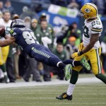 Seattle Seahawks' Doug Baldwin can't catch a pass in front of Green Bay Packers' Casey Hayward (29) during the first half of the NFL football NFC Championship game Sunday, Jan. 18, 2015, in Seattle. (AP Photo/Elaine Thompson)