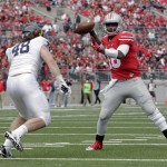 Ohio State quarterback J.T. Barrett drops back to pass against Kent State during the second quarter of an NCAA college football game Saturday, Sept. 13, 2014, in Columbus, Ohio. Ohio State won 66-0. (AP Photo/Jay LaPrete)