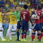 Referee Carlos Velasco Carballo from Spain separates players during the World Cup quarterfinal soccer match between Brazil and Colombia at the Arena Castelao in Fortaleza, Brazil, Friday, July 4, 2014. (AP Photo/Manu Fernandez)