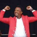 National Baseball Hall of Fame electee Pedro Martinez reacts to cheering fans during an awards ceremony at Doubleday Field on Saturday, July 25, 2015, in Cooperstown, N.Y. Martinez will be inducted Sunday. (AP Photo/Mike Groll)
