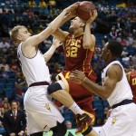 Southern California's Nikola Jovanovic, center, shoots against Arizona State's Jonathan Gilling, left, and Chance Murray in the first half of an NCAA college basketball game in the first round of the Pac-12 conference tournament Wednesday, March 11, 2015, in Las Vegas. (AP Photo/John Locher)