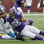 Carolina Panthers running back Jonathan Stewart, left, is tackled by Minnesota Vikings outside linebacker Anthony Barr during the first half of an NFL football game, Sunday, Nov. 30, 2014, in Minneapolis. (AP Photo/Ann Heisenfelt)