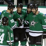 Dallas Stars' defenseman Jordie Benn (24), center Jason Spezza (90), right Wing Ales Hemsky (83), of the Czech Republic, defenseman Jason Demers (4) and left wing Erik Cole (72) celebrates after Hemsky scored in the third period of an NHL hockey game against the Arizona Coyotes, Wednesday, Dec. 31, 2014, in Dallas. (AP Photo/Sharon Ellman)