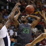 Arizona's Rondae Hollis-Jefferson, left, blocks Oregon's Elgin Cook during the first half of an NCAA college basketball game in the championship of the Pac-12 conference tournament Saturday, March 14, 2015, in Las Vegas. (AP Photo/John Locher)