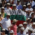 Supporters of Spain's Rafael Nadal hold a banner reading "Go on Rafa" as he plays Serbia's Novak Djokovic during the final match of the French Open tennis tournament at the Roland Garros stadium, in Paris, France, Sunday, June 8, 2014. (AP Photo/Michel Euler)