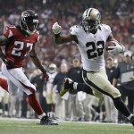 New Orleans Saints running back Mark Ingram (22) moves toward the goal line as Atlanta Falcons cornerback Robert McClain (27) chases during the second half of an NFL football game, Sunday, Sept. 7, 2014, in Atlanta. Ingram scored a touchdown on the play. (AP Photo/David Goldman)