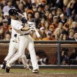 San Francisco Giants' Juan Perez hits a two-run scoring double during the eighth inning of Game 5 of baseball's World Series against the Kansas City Royals Sunday, Oct. 26, 2014, in San Francisco. (AP Photo/David J. Phillip)