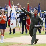 Air National Guard Colonel Doug Champagne throws out a ceremonial first pitch before the Detroit Tigers baseball game against the Toronto Blue Jays on Independence Day Saturday, July 4, 2015, in Detroit. (AP Photo/Duane Burleson)
