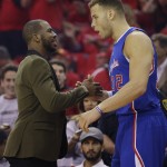 Los Angeles Clippers' Chris Paul, left, talks with teammate Blake Griffin (32) prior to Game 1 in a second-round NBA basketball playoff series against the Houston Rockets, Monday, May 4, 2015, in Houston. Chris Paul is out for game 1 with a strained left hamstring. (AP Photo/David J. Phillip)