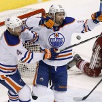  Edmonton Oilers' Sam Gagner (89) celebrates his goal against the Phoenix Coyotes with teammate Taylor Hall (4) during the third period of an NHL hockey game, Friday, April 4, 2014, in Glendale, Ariz. The Oilers defeated the Coyotes in a shootout, 3-2. (AP Photo/Ross D. Franklin)