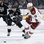 Arizona Coyotes left wing Martin Erat, right, controls the puck as Los Angeles Kings center Nick Shore, left, defends during the first period of an NHL hockey game, Monday, March 16, 2015, in Los Angeles. (AP Photo/Danny Moloshok)