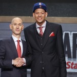 Baylor center Isaiah Austin, right, poses for a photo with NBA Commissioner Adam Silver after being granted ceremonial first round pick during the 2014 NBA draft, Thursday, June 26, 2014, in New York. Austin, who was projected to be a first round selection was diagnosed with Marfan syndrome just four days before the draft. (AP Photo/Jason DeCrow)