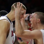 Arizona guard T.J. McConnell, right, celebrates with Kaleb Tarczewski after defeating Gonzaga 66-63 in overtime during an NCAA college basketball game, Saturday, Dec. 6, 2014, in Tucson, Ariz. (AP Photo/Rick Scuteri)
