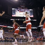 Wisconsin's Josh Gasser (21) grabs a rebound during the first half of the NCAA Final Four college basketball tournament championship game against Duke Monday, April 6, 2015, in Indianapolis. (AP Photo/Michael Conroy)