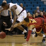 Arizona State's Gerry Blakes, left, and Southern California's Julian Jacobs battle for the ball in the first half of an NCAA college basketball game in the first round of the Pac-12 Conference tournament Wednesday, March 11, 2015, in Las Vegas. (AP Photo/John Locher)