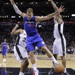 Los Angeles Clippers' Blake Griffin (32) is fouled by San Antonio Spurs' Boris Diaw, left, as he tries to score during the first half of Game 6 in an NBA basketball first-round playoff series, Thursday, April 30, 2015, in San Antonio. (AP Photo/Darren Abate)