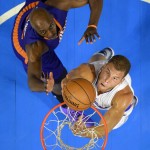 Los Angeles Clippers forward Blake Griffin, below, puts up a shot as Phoenix Suns forward Anthony Tolliver defends during the first half of a preseason NBA basketball game, Wednesday, Oct. 22, 2014, in Los Angeles. (AP Photo/Mark J. Terrill)